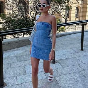 Brand new denim dress. Cute and trendy.